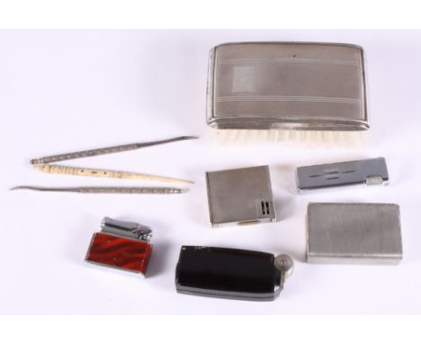 A gentleman's silver backed hair brush, a hip flask, in leather case, four cigarette lighters, nut pickers, etc 