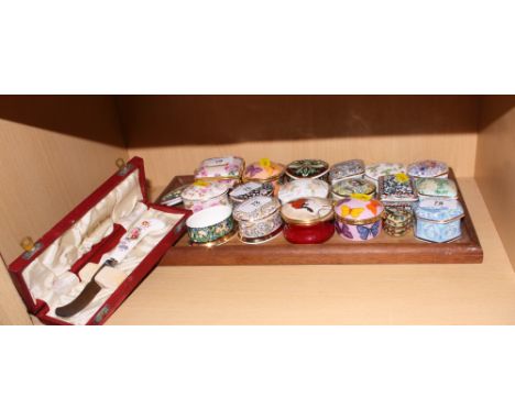 A collection of eighteen assorted decorative ceramic trinket boxes and a Crown Derby butter knife, in presentation case 