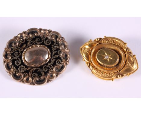 A yellow metal and black enamel mourning brooch and a Victorian gilt metal brooch, set single diamond 