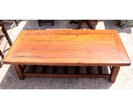 An African trackwood coffee table with slatted undershelf, 54" x 28", and a matching lamp table 