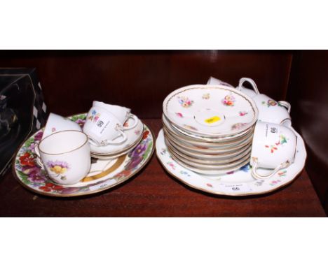 A set of 19th Century Meissen porcelain tea cups and saucers, painted flowers, a pair of modern Meissen teacups and saucers a