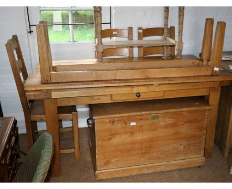 An oak dining table, fitted frieze drawer, on square supports, 64" x 35", three similar ladder back dining chairs and a simil