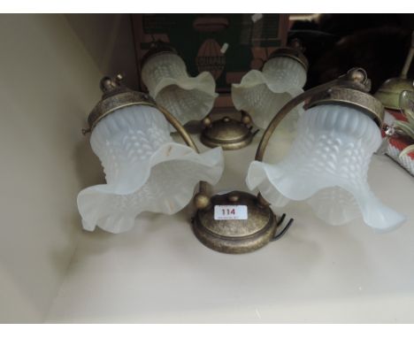 A pair of brass effect double wall light fittings