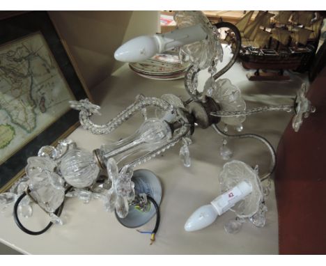 A metal and glass three candle light fitting