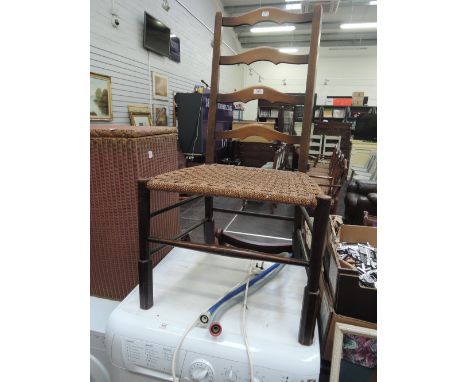 A stained frame ladder back chair with woven seat