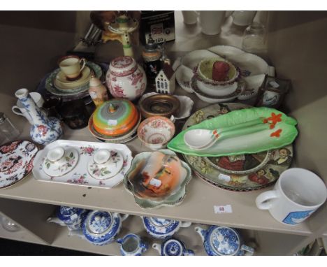 A shelf of ceramics including Beswick, Masons, Royal Doulton, Royal Crown Derby and Poole etc