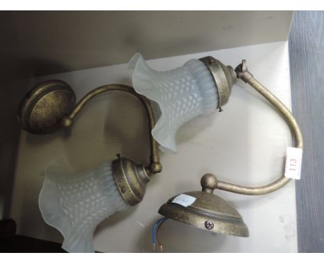 A pair of brass effect wall light fittings