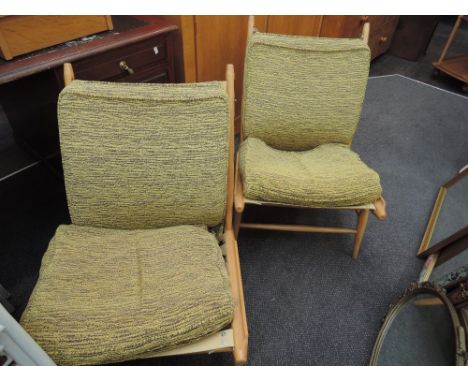 A pair light Ercol easy chairs