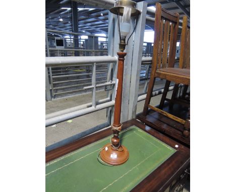 A traditional style tall table lamp