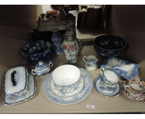 A shelf of blue and white vases, bowls, Losal vaseincluding Adams, Keeling & Co etc