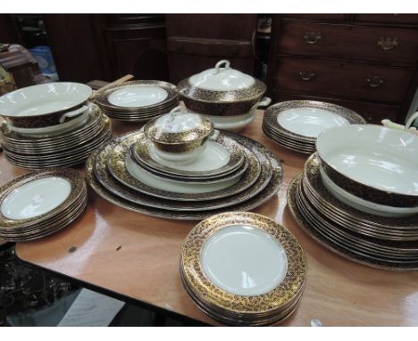 An Ashworth Bros Ironstone part dinner service in blue and gilt decoration including meat platters, tureens etc (some chips)