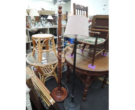 A turned wooden standard lamp and a metal standard lamp