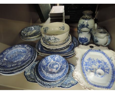 A shelf of blue and white tableware including Enoch Woods, Royal Staffordshire etc