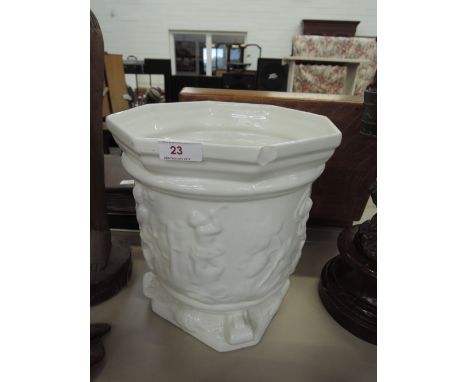 A white ceramic planter