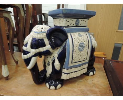 A reproduction ceramic elephant seat