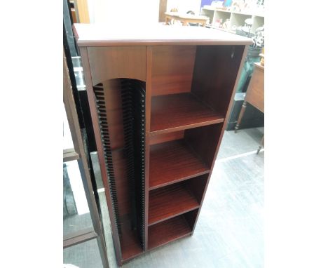 A late 20th century wood laminate shelf unit and CD rack