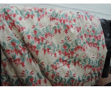 A pair of floral quilted and lined curtains