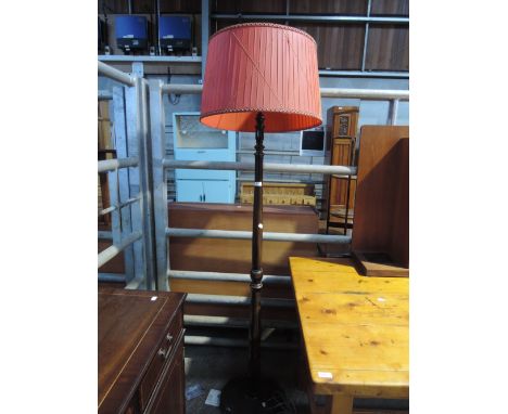 A traditional stained frame standard lamp
