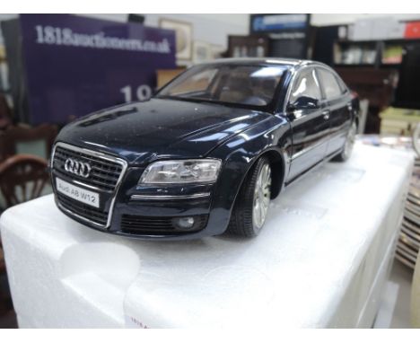 A Die-cast 1:18 scale model Audi A8 W12 by Kyosho