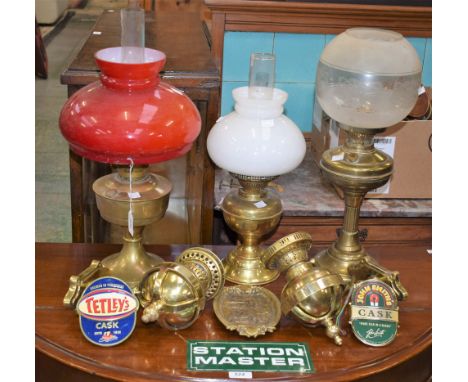 A Duplex oil lamp; an Aladdin oil lamp; another similar; a pair brass wall lights; a station master sign; beer pump clips; a 