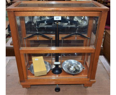 An L Oertling Ltd, London, model 21A cased scales; a Griffin and George Ltd set of cased weights 