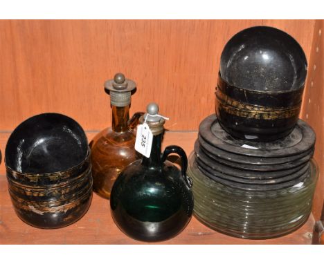 A set of ten paper mache gilt circular bowls, six side plates; a pewter mounted amber glass decanter; another, green; etc