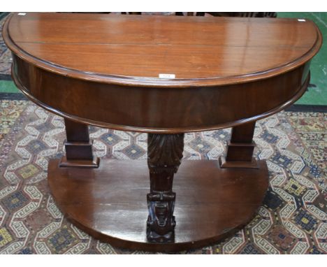 A '19th century' mahogany demi lune side table, moulded half hinged top enclosing a niche above a deep frieze supported by a 