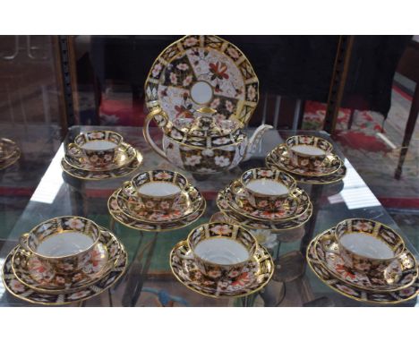 A Royal Crown Derby 2451 pattern part tea service, for seven, comprising boat shaped teapot, teacups, saucers and tea plates 