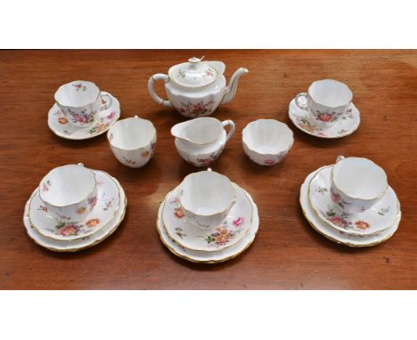 A Royal Crown Derby Posies pattern part tea service for six, including cups, saucers, side plates, teapot, milk jug and sugar