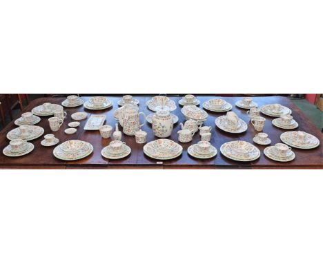 An extensive Minton Haddon Hall pattern dinner service, including dinner plates, salad plates, side plates and tea platters, 