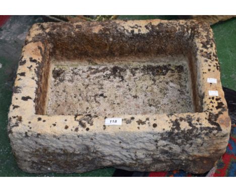 A small gritstone trough, 21cm high, 52cm wide