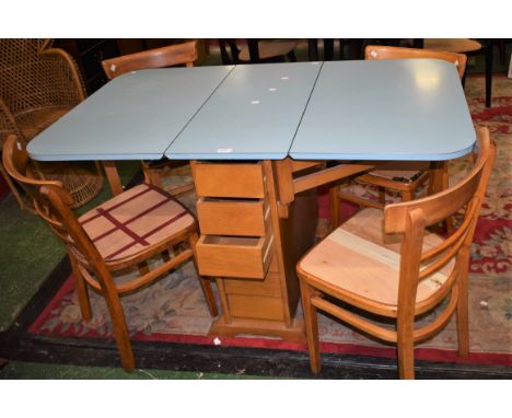 A mid 20th century teak gateleg kitchen dining table, melamine drop leaf top supported by a substantial base fitted with six 