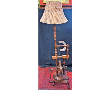 A novelty standard lamp, in the form of a spinning wheel