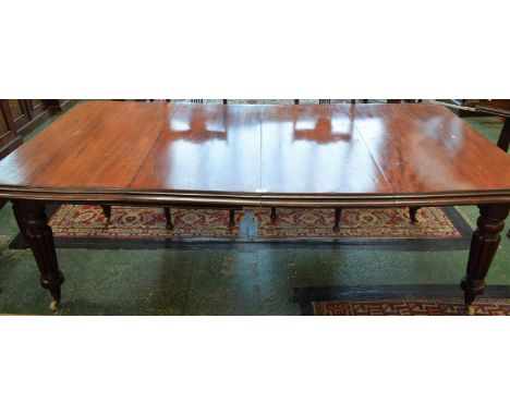 A Victorian mahogany rounded rectangular extending dining table, turned and fluted legs, ceramic casters, extends to 205cm wi