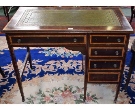 An Edwardian mahogany writing desk, moulded rectangular top with inset tooled and gilt leather writing surface above an arran