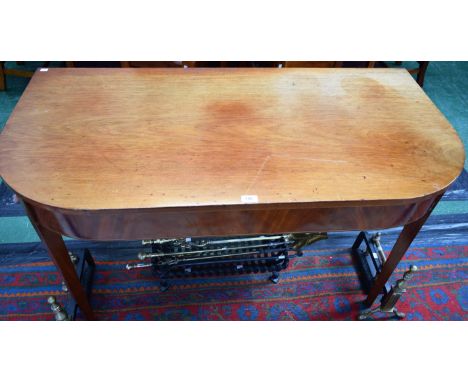 A George III mahogany side table, rounded rectangular top above a deep frieze outlined with boxwood and ebony stringing, tape