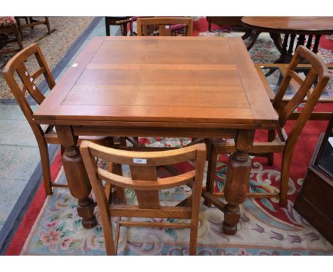 A light oak drawleaf dining table; a set of four conforming dining chair frames (5)