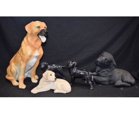 A large Sandicast model, of a black Labrador puppy; others, ceramic, seated Golden Retriever; etc (5) 