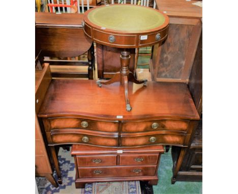 A reproduction mahogany side table, shaped top above four short drawers, tapered square legs, spade feet, 106.5cm wide; a sim