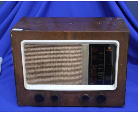 VINTAGE PYI WIRELESS
with cream square plastic surrounding the speaker with four dials below, plywood body, 46cm long