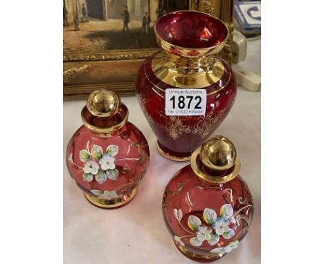 A pair of Bohemian ruby glass flower decorated perfume bottles &amp; a red glass vase
