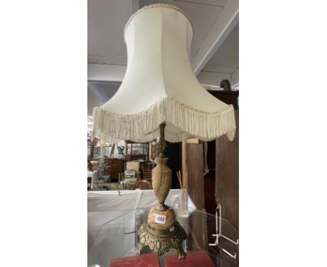 A vintage table lamp with striped onyx base and complete with shade, COLLECT ONLY.