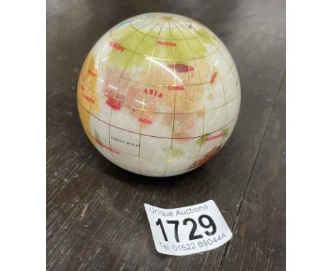A vintage semi precious small globe
