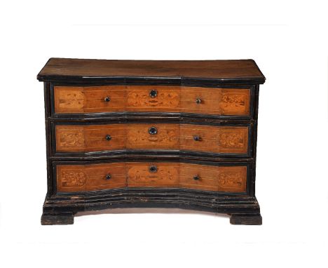 An Italian walnut and marquetry inlaid chest, c. 1700, probably Lombard, the shaped rectangular top above three long similarl