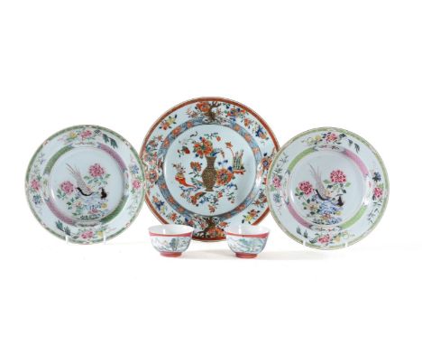 A Pair of Chinese 'Famille Rose' soup bowls, 18th century, painted with two birds perched on a rock, 22.5cm diameter; a 'Fami