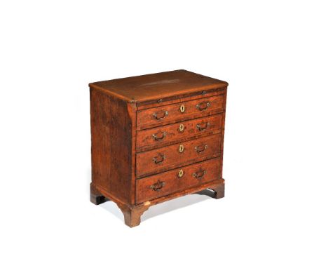 A walnut and oak bachelor’s chest, circa 1720 and later, the rectangular top above a brushing slide and four long graduated d