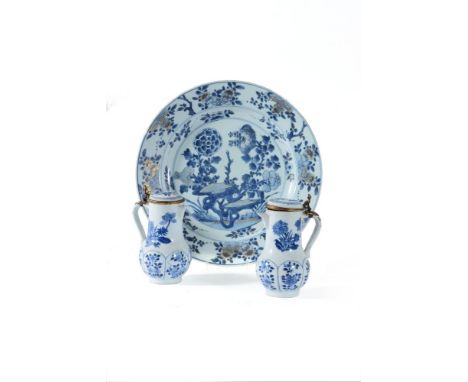 A pair of Chinese blue and white ewers and covers, Kangxi,  with gilt metal mounts and scroll handles, 17cm high; and a Chine