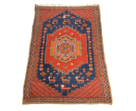 A woven carpet, probably Moroccan, approximately 333 x 179cm, together with another woven rug, probably Moroccan, approximate