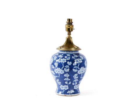 A Chinese blue and white ‘prunus’ vase, late 18th or 19th century, mounted as a lamp, the base with four character mark in un