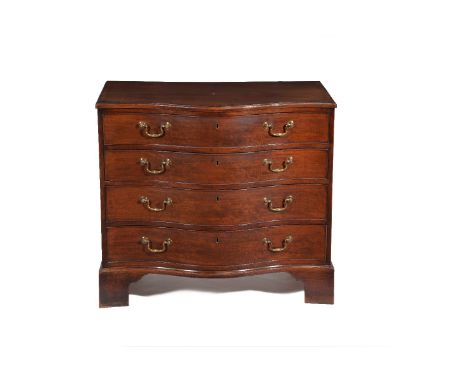 A George III mahogany and crossbanded serpentine chest, circa 1770, the shaped rectangular crossbanded top above four long gr